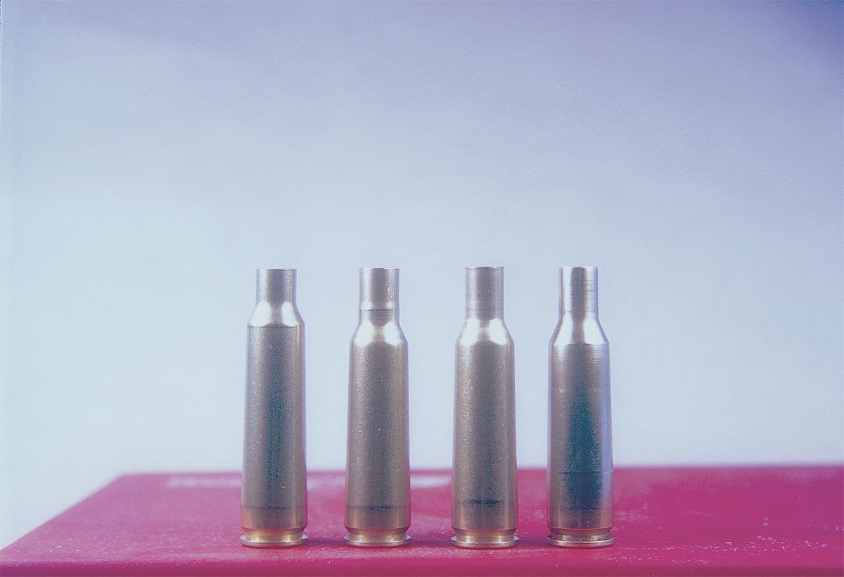 Three steps to case forming, from left: 250 Savage, after form die, after full-length sizing in the 6mm Remington International die and after fireforming.